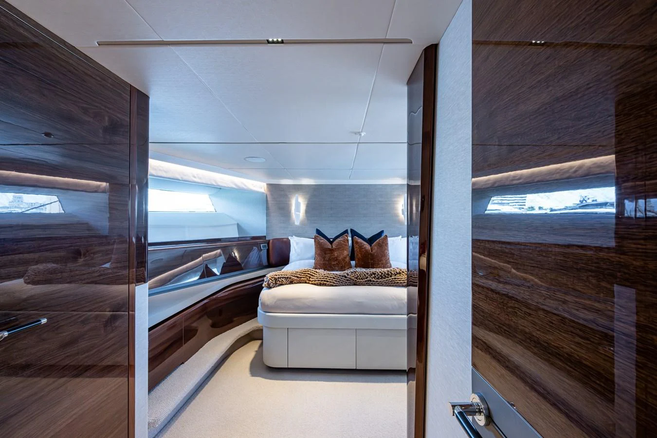 a room with a bed and a large window aboard SPLASH Yacht for Sale
