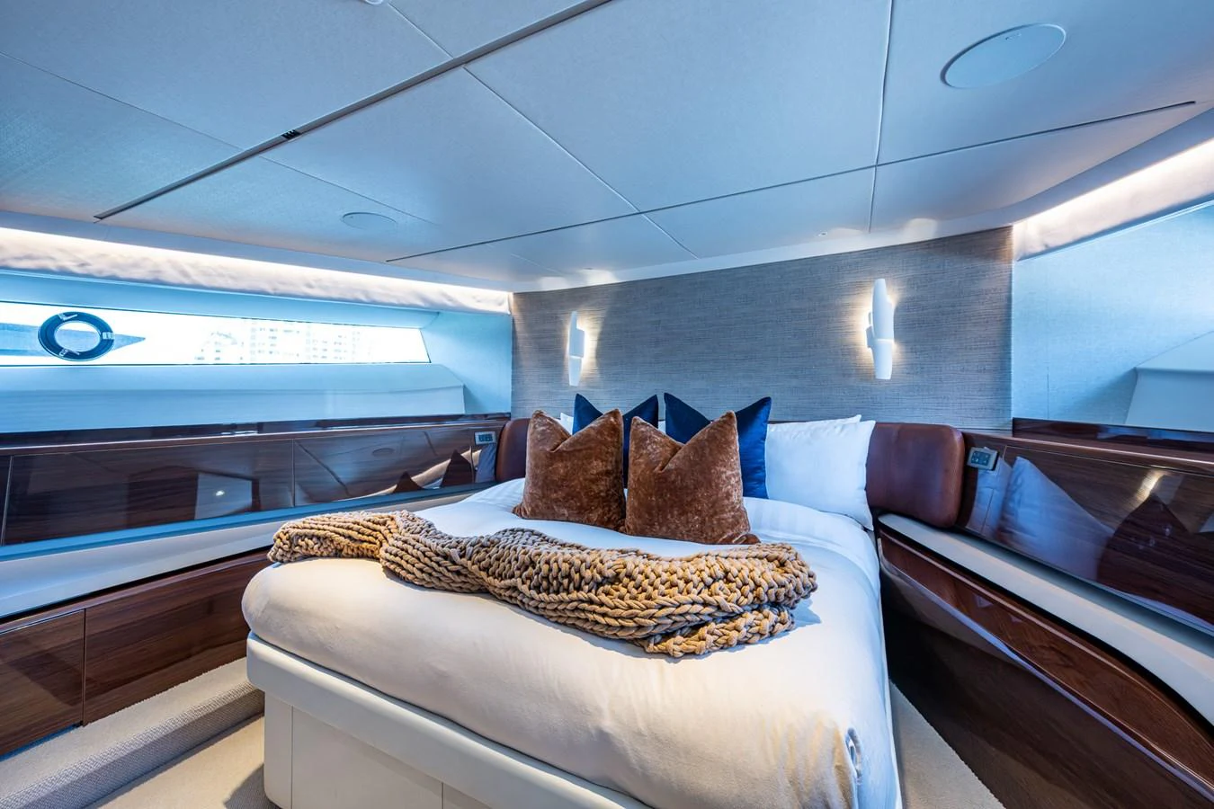 a room with a bed and a pillow on the bed aboard SPLASH Yacht for Sale