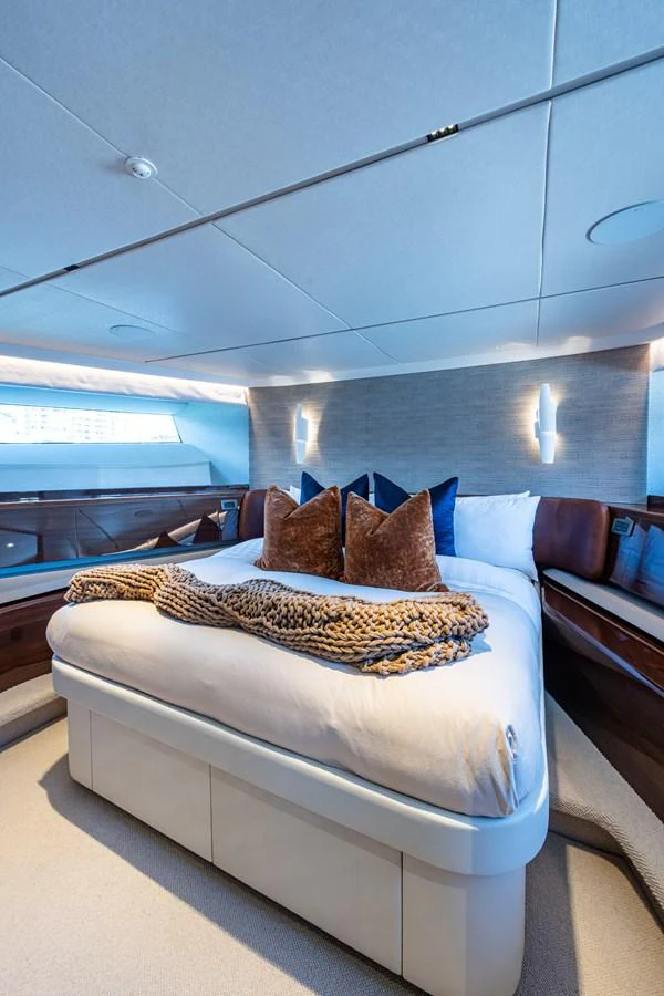 a bed with a pillow aboard SPLASH Yacht for Sale