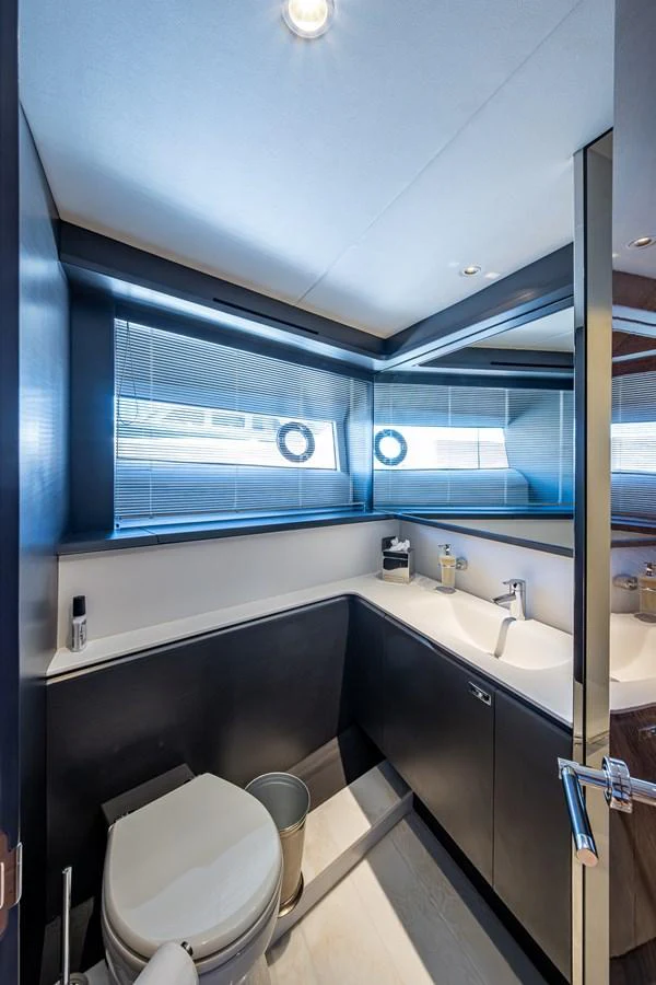 a bathroom with a large window aboard SPLASH Yacht for Sale