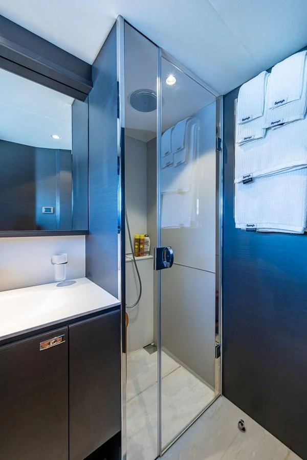 a bathroom with a shower unit aboard SPLASH Yacht for Sale