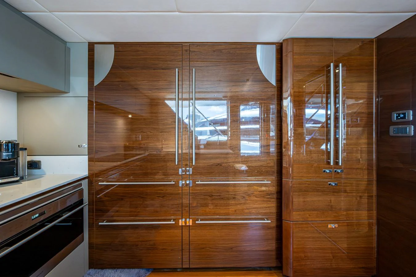 a wooden cabinet in a kitchen aboard SPLASH Yacht for Sale