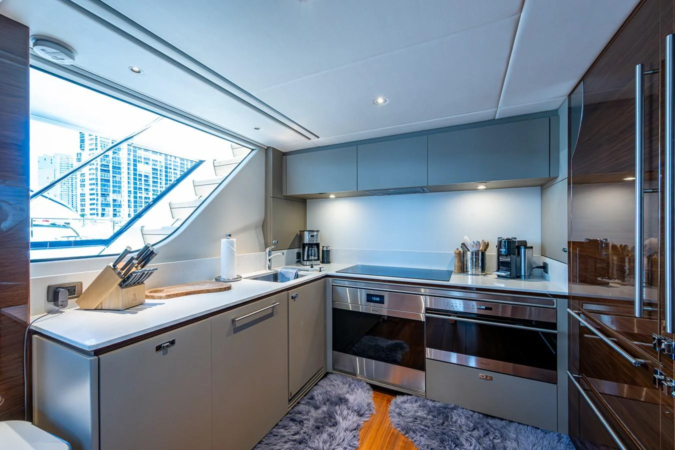 a kitchen with a large window aboard SPLASH Yacht for Sale
