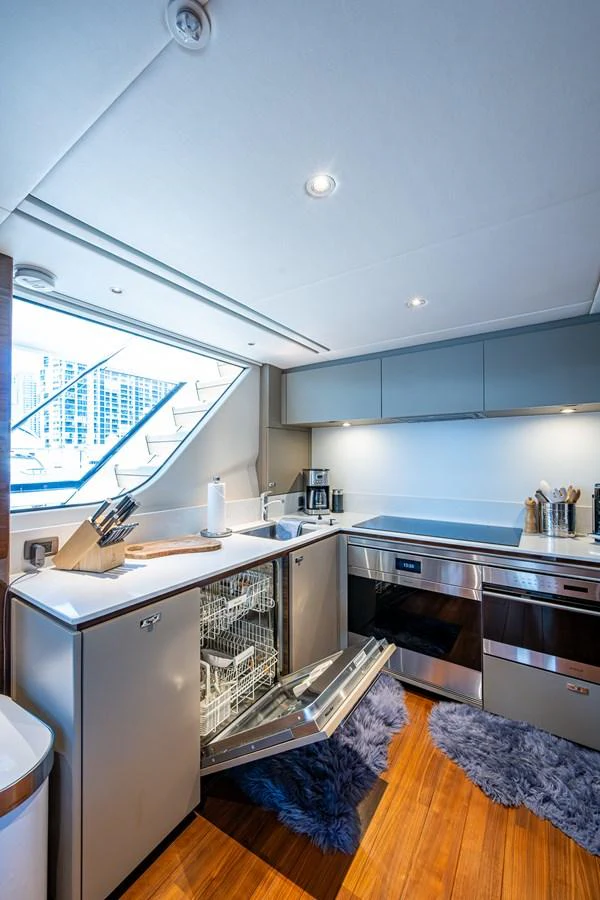 a kitchen with a large window aboard SPLASH Yacht for Sale