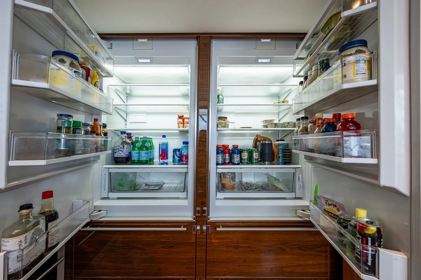 a refrigerator with many drinks aboard SPLASH Yacht for Sale