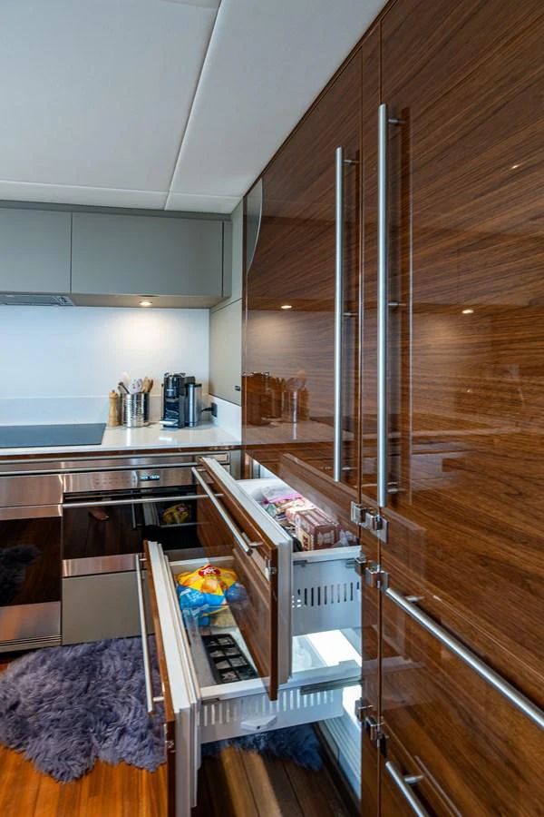 a kitchen with a ladder aboard SPLASH Yacht for Sale
