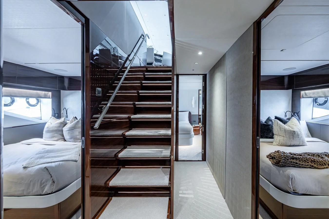 a room with a bed and a staircase aboard SPLASH Yacht for Sale