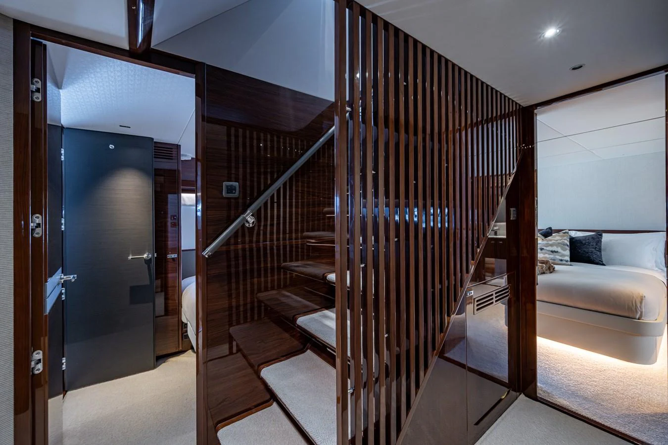a room with a bed and a couch aboard SPLASH Yacht for Sale