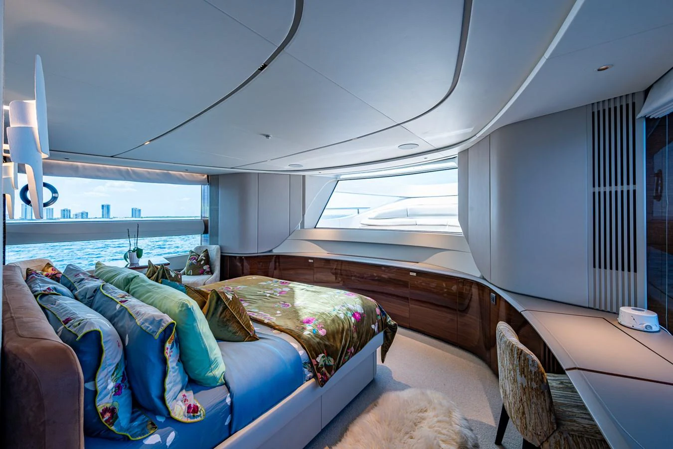 a room with a bed and a chair aboard SPLASH Yacht for Sale
