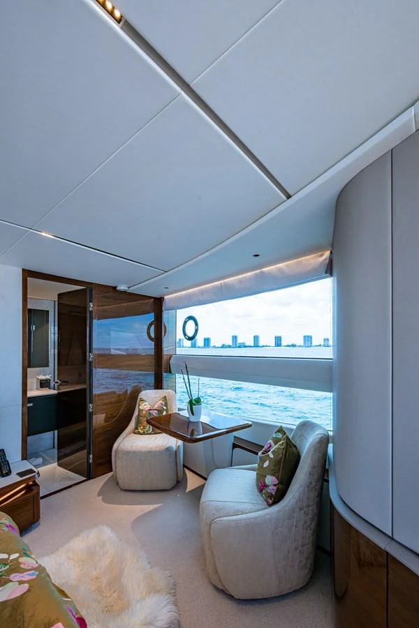 a living room with a large window aboard SPLASH Yacht for Sale