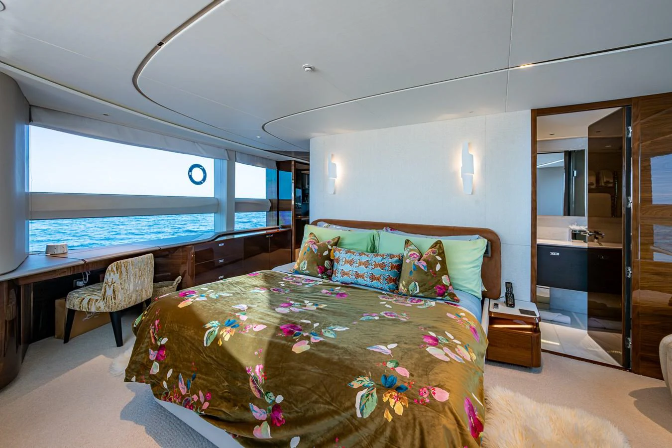 a bedroom with a large bed aboard SPLASH Yacht for Sale