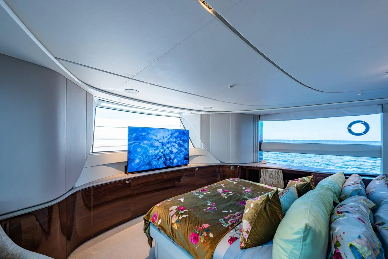 a bed with a pillow on it aboard SPLASH Yacht for Sale