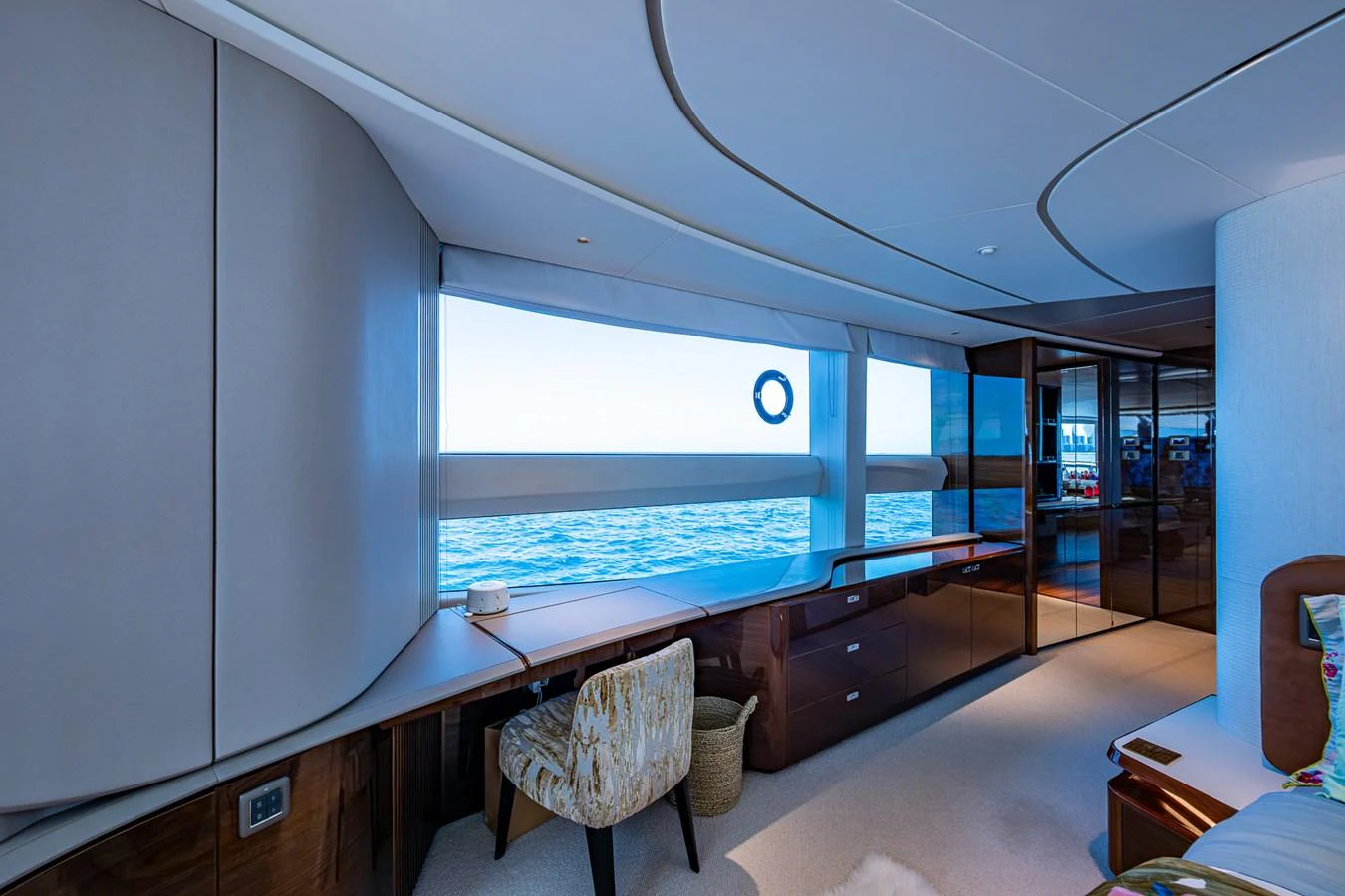 a room with a view of the water and the deck aboard SPLASH Yacht for Sale