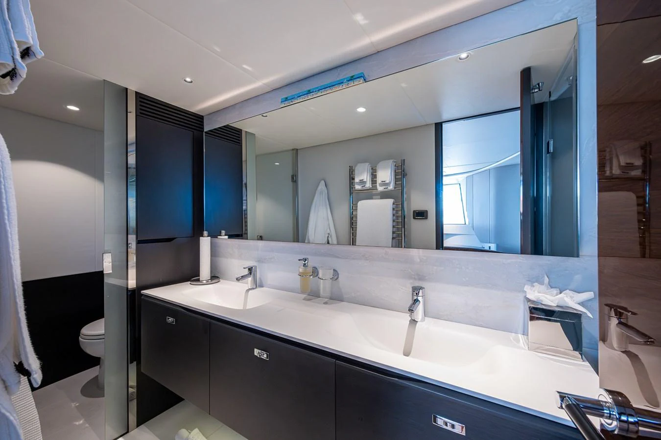 a bathroom with a large mirror aboard SPLASH Yacht for Sale