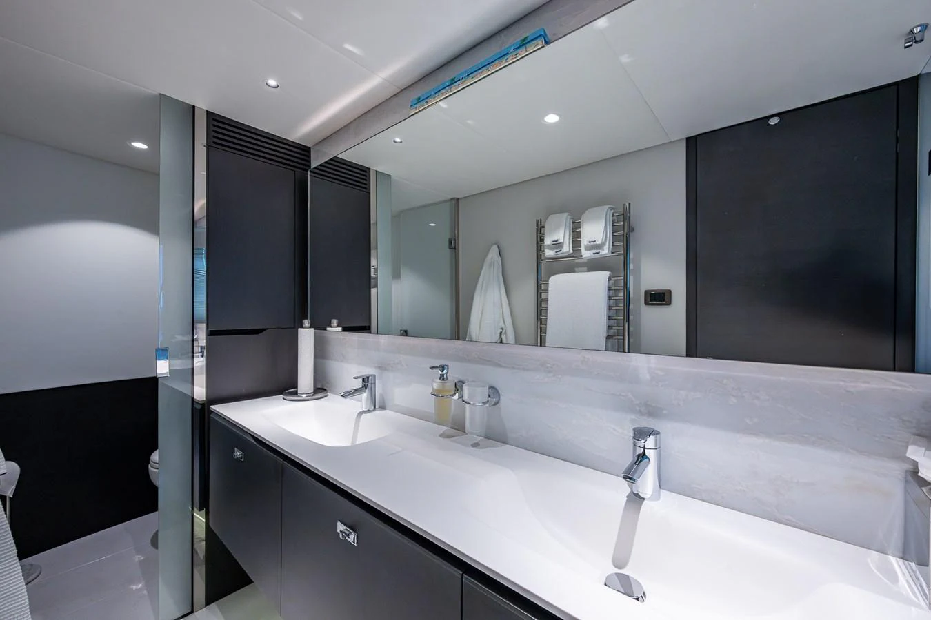 a bathroom with a large mirror aboard SPLASH Yacht for Sale