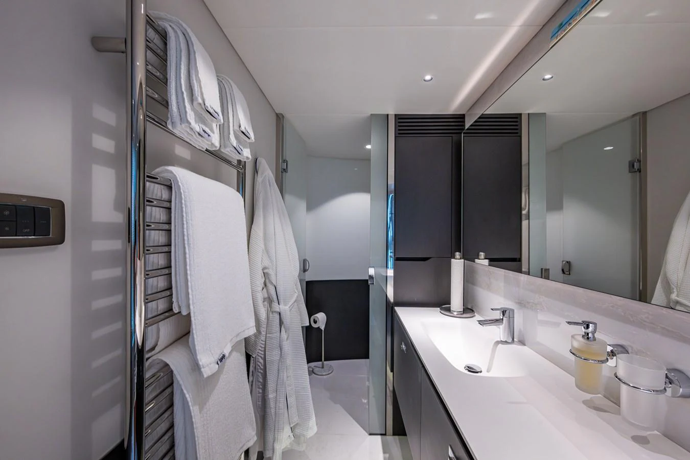 a bathroom with a large mirror aboard SPLASH Yacht for Sale