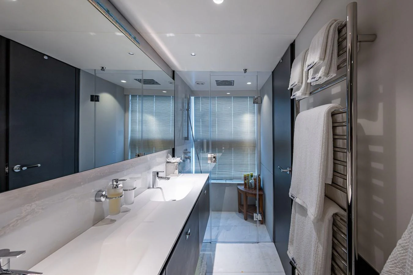 a bathroom with a sink and a mirror aboard SPLASH Yacht for Sale