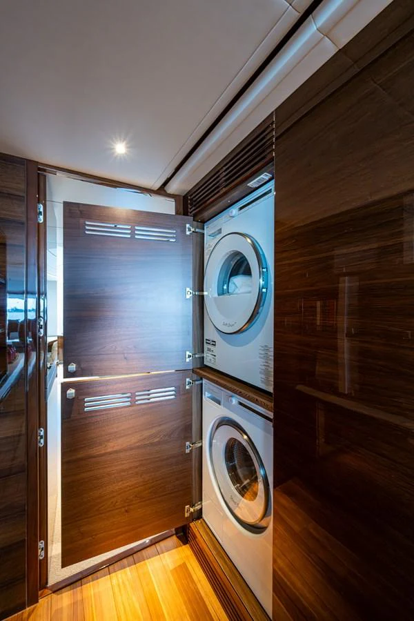 a room with a washer and dryer aboard SPLASH Yacht for Sale