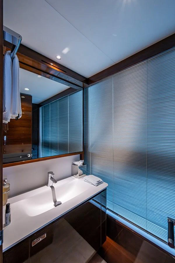 a bathroom with a sink and a mirror aboard SPLASH Yacht for Sale