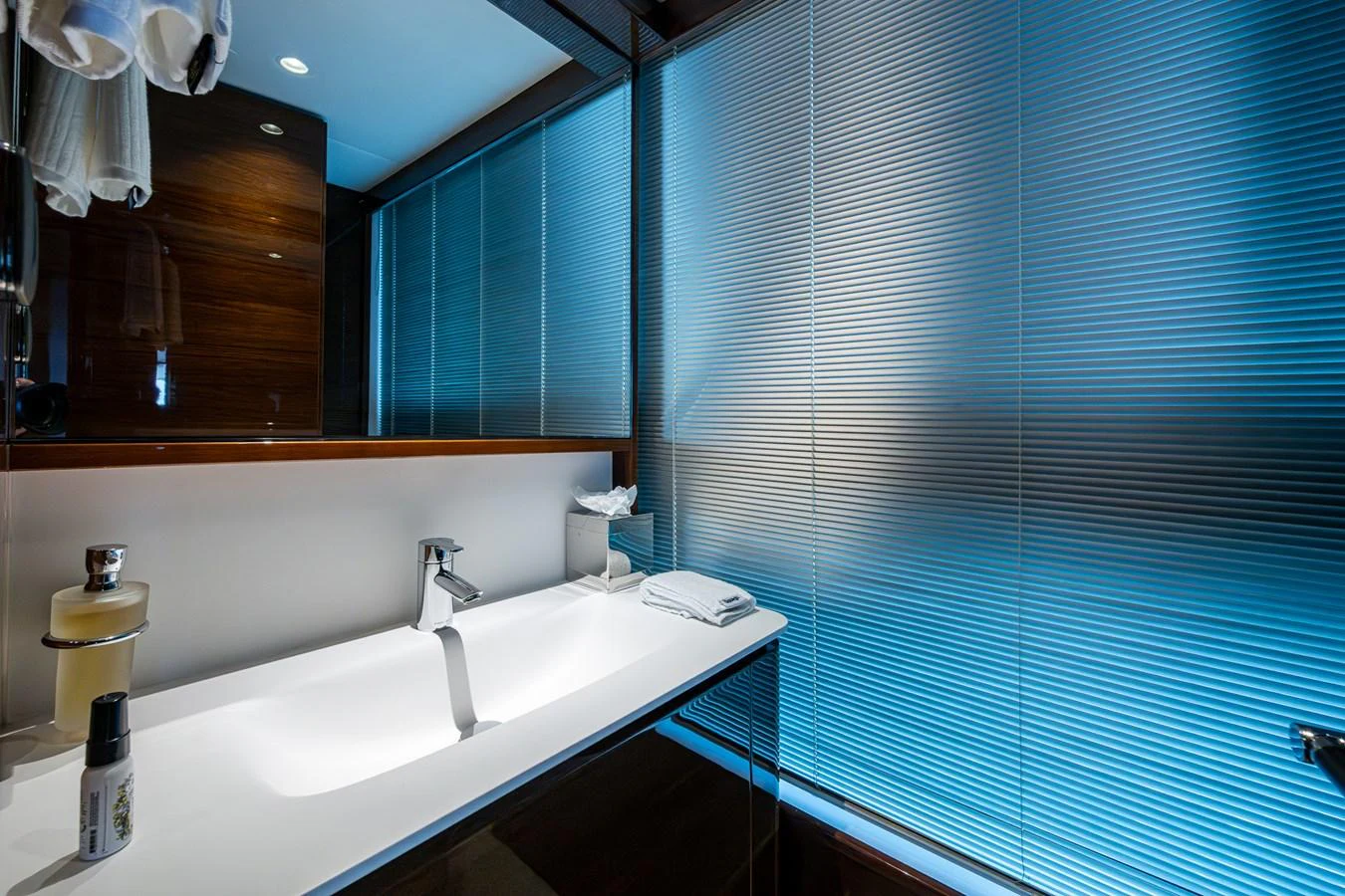 a bathroom with a sink and a mirror aboard SPLASH Yacht for Sale