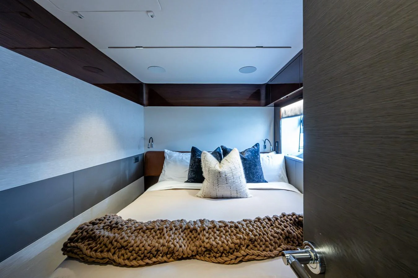 a bed with a pillow aboard SPLASH Yacht for Sale