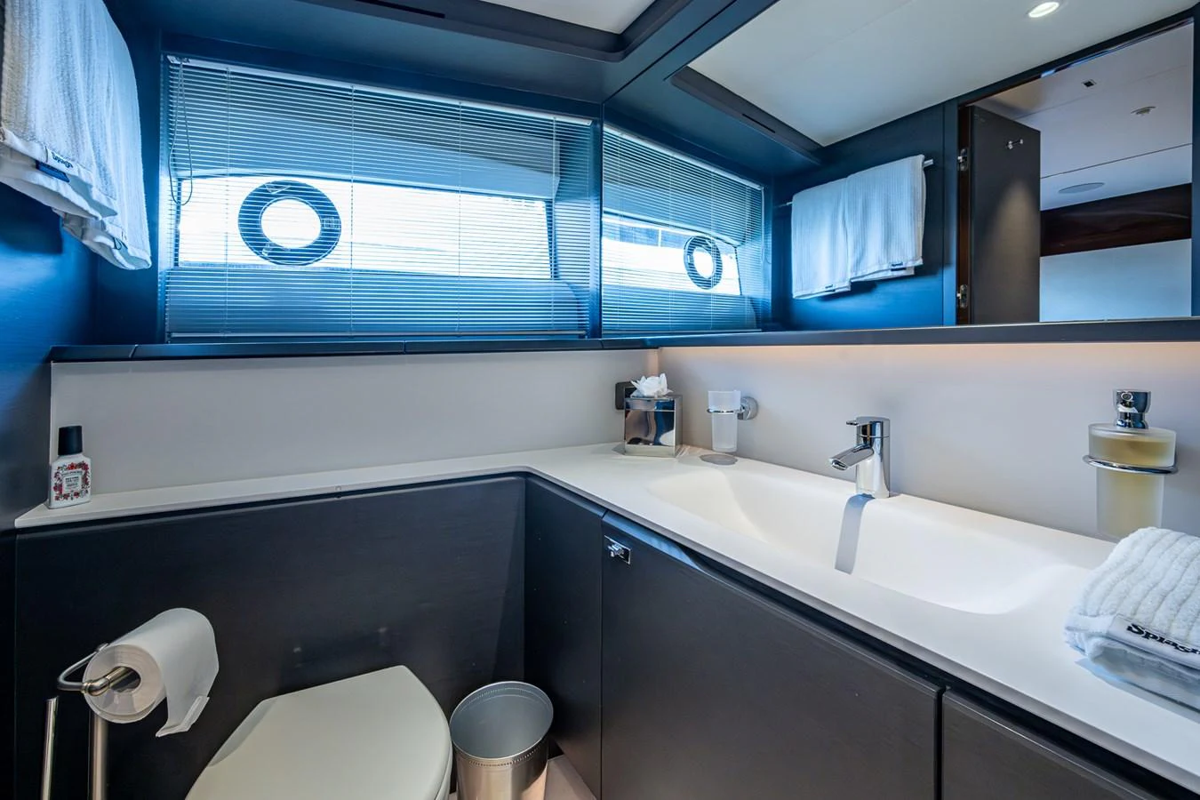 a bathroom with a large mirror aboard SPLASH Yacht for Sale