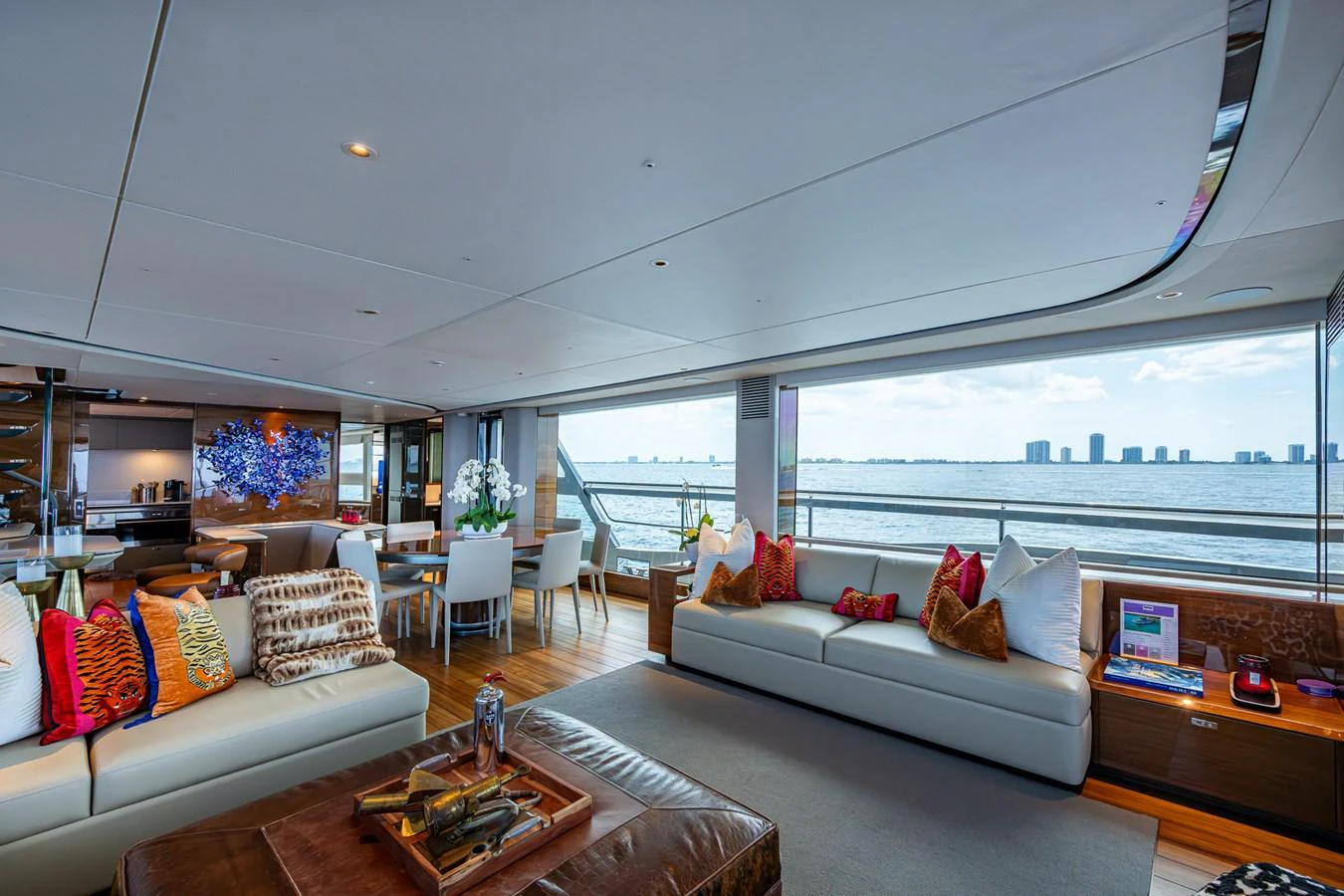 a living room with a large window aboard SPLASH Yacht for Sale
