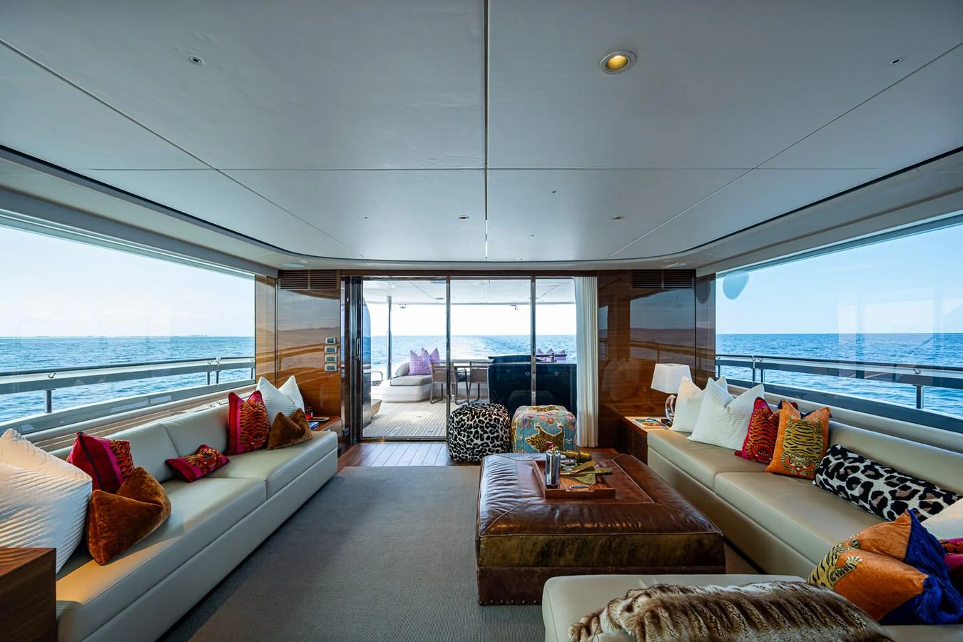 a living room with a large window aboard SPLASH Yacht for Sale