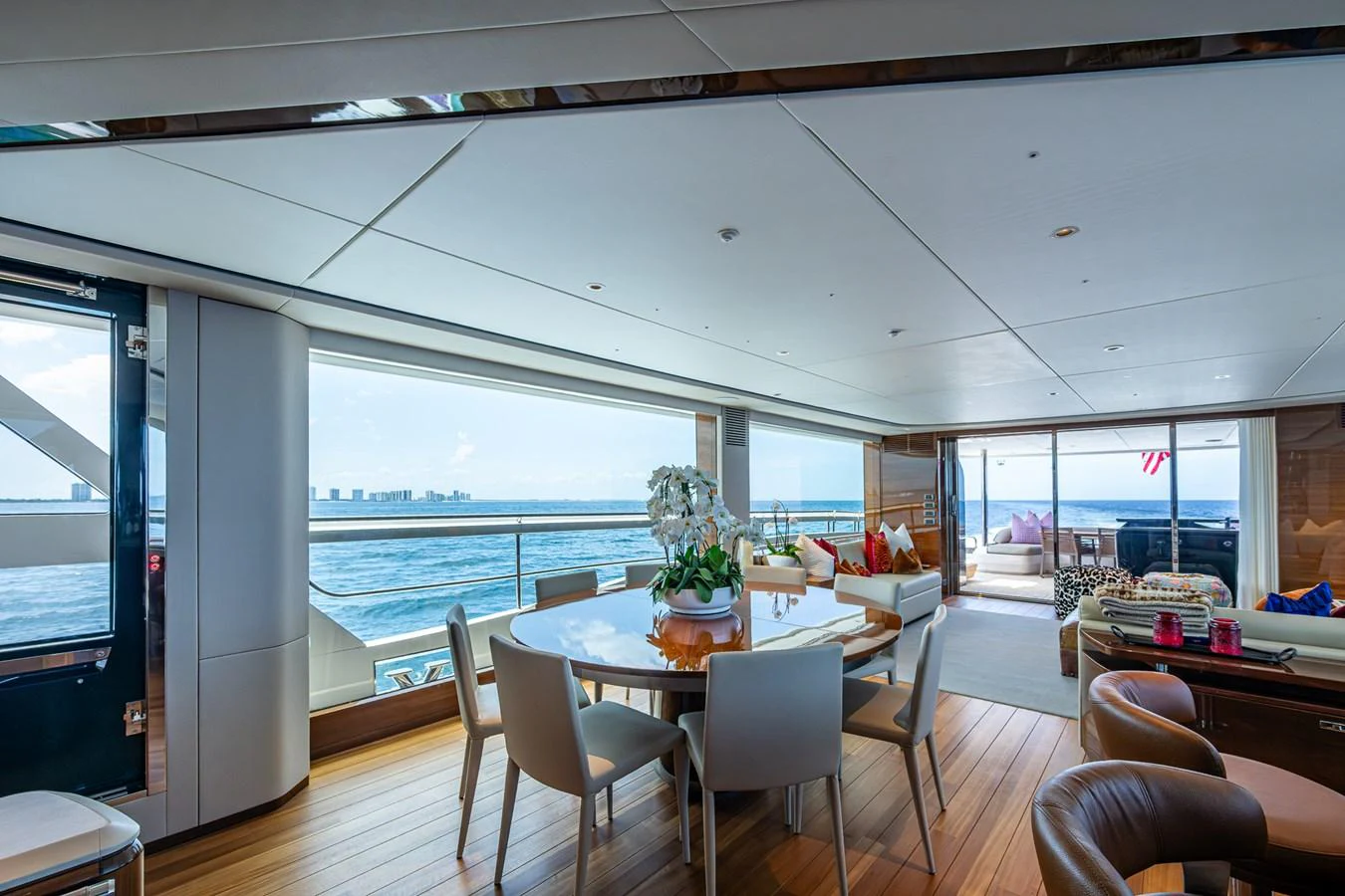 a room with a table and chairs aboard SPLASH Yacht for Sale