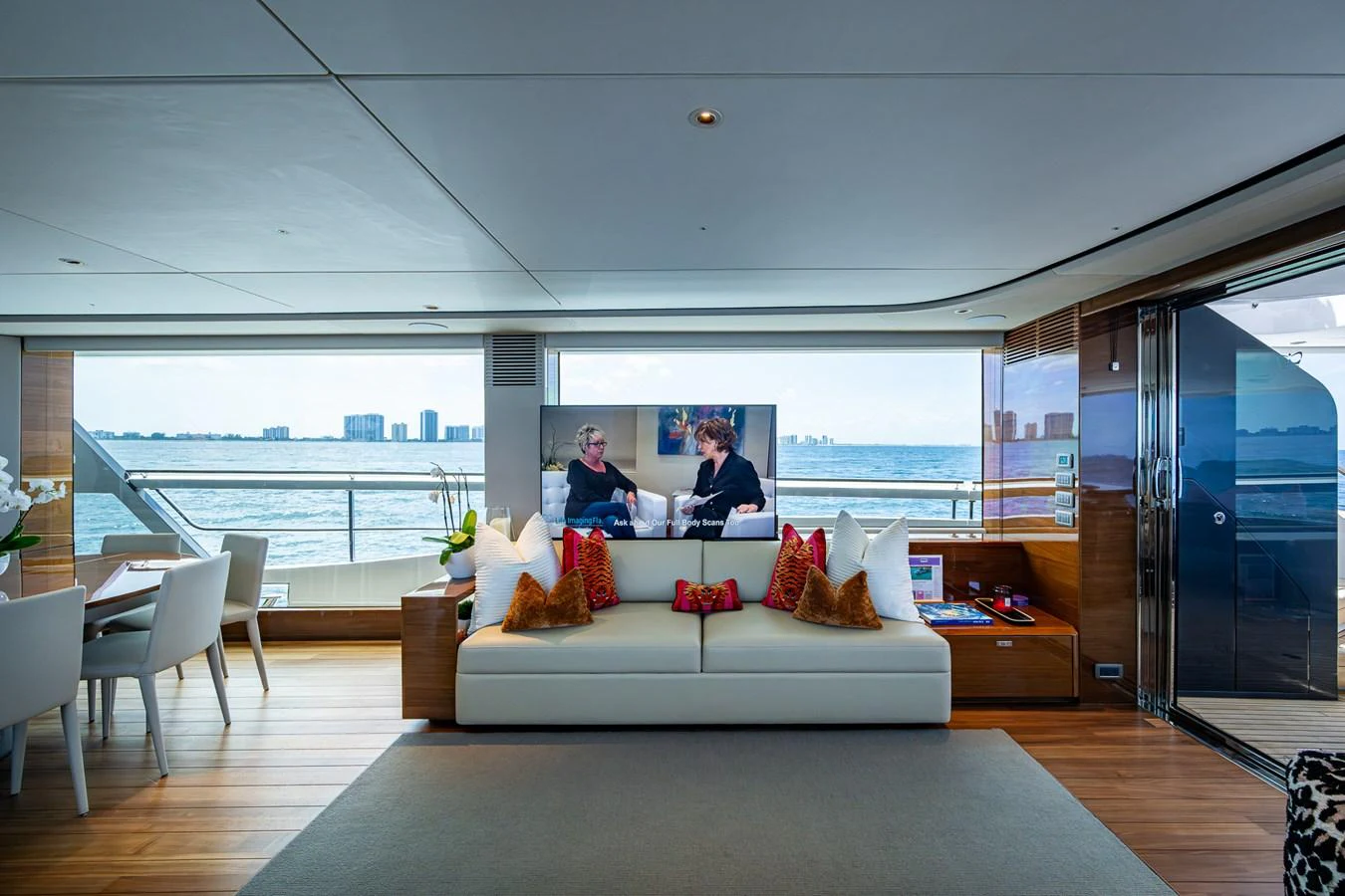 a couple sitting on a couch aboard SPLASH Yacht for Sale
