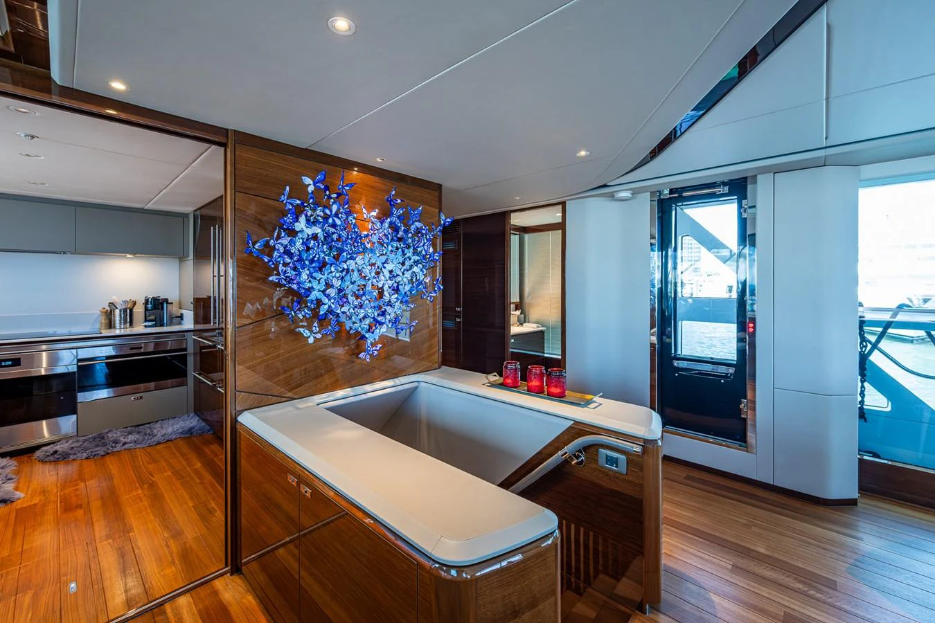 a large kitchen with a large window aboard SPLASH Yacht for Sale