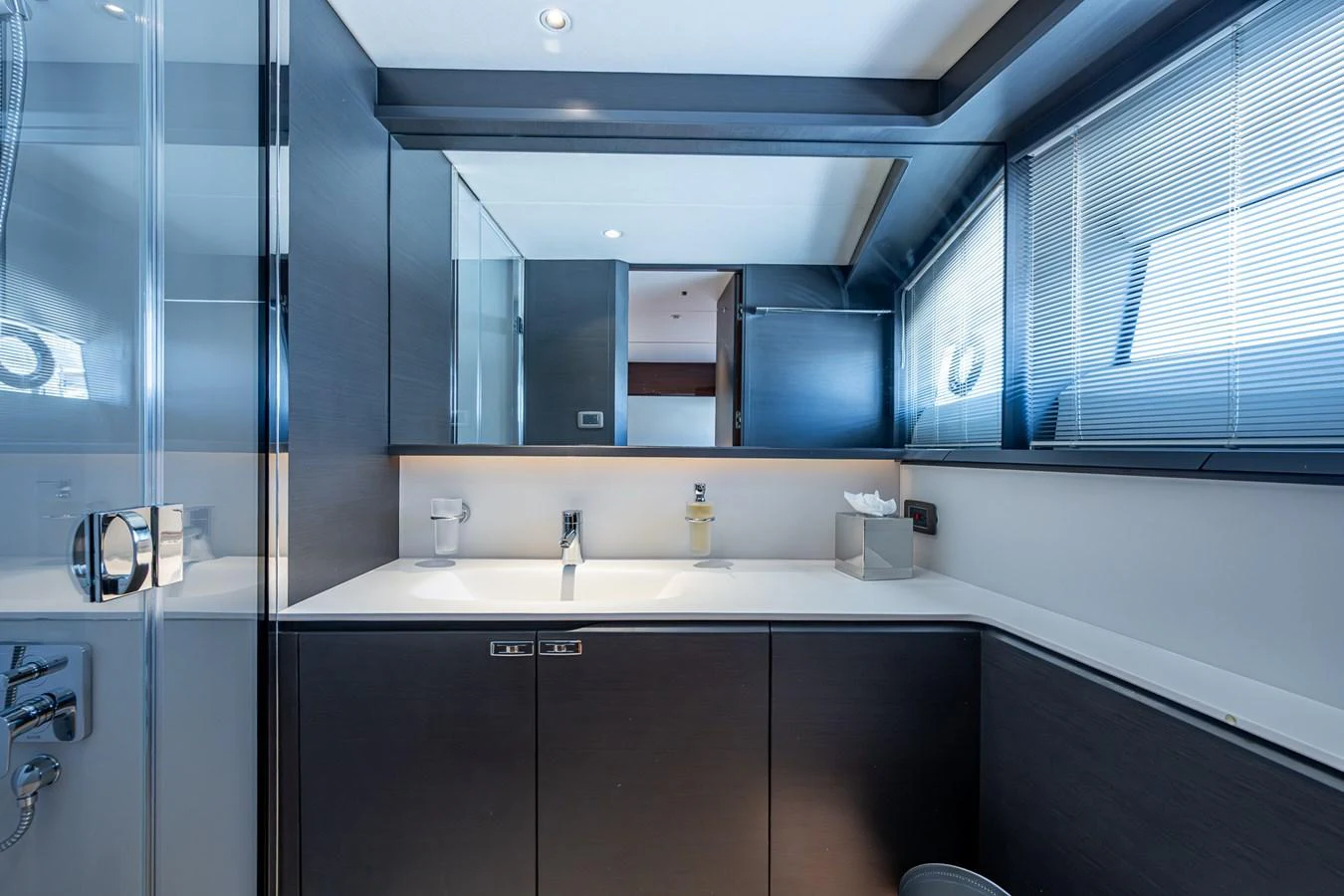 a bathroom with a glass shower unit aboard SPLASH Yacht for Sale