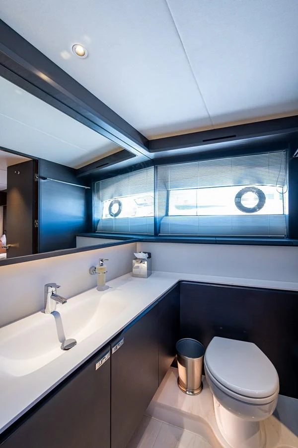 a bathroom with a large window aboard SPLASH Yacht for Sale