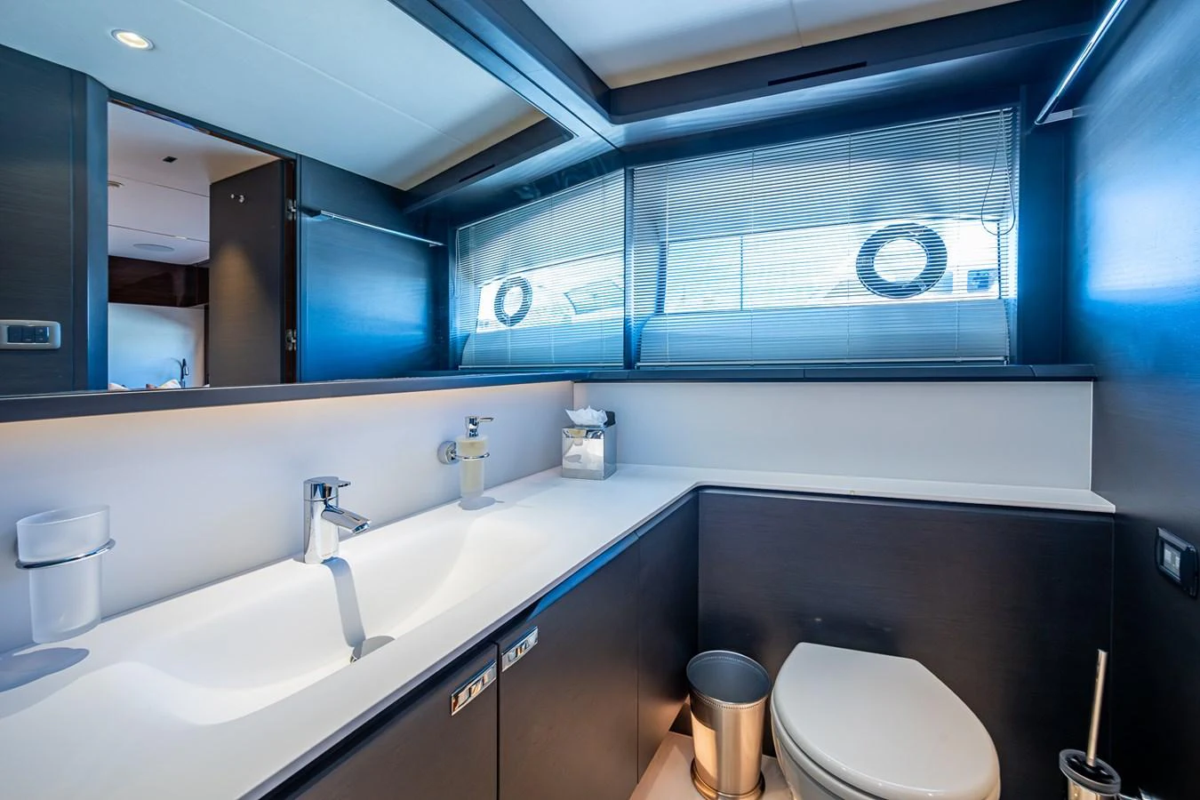 a bathroom with a large mirror aboard SPLASH Yacht for Sale