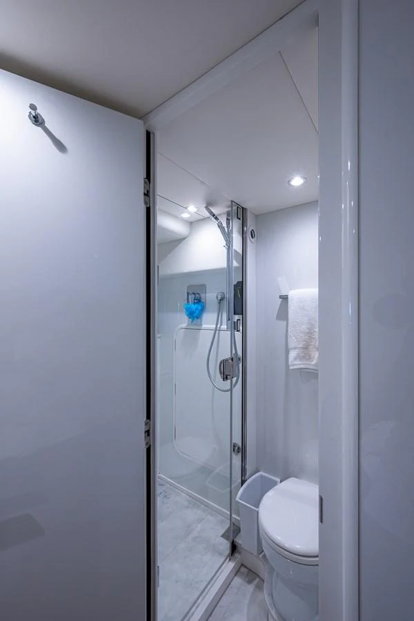 a bathroom with a glass shower aboard SPLASH Yacht for Sale