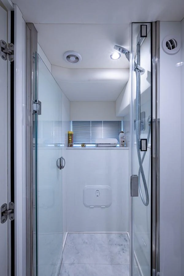 a bathroom with a shower unit aboard SPLASH Yacht for Sale