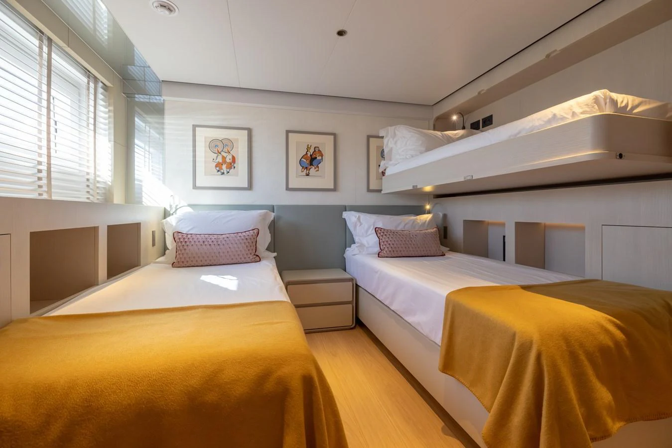 a room with three beds aboard STELLAMAR Yacht for Sale