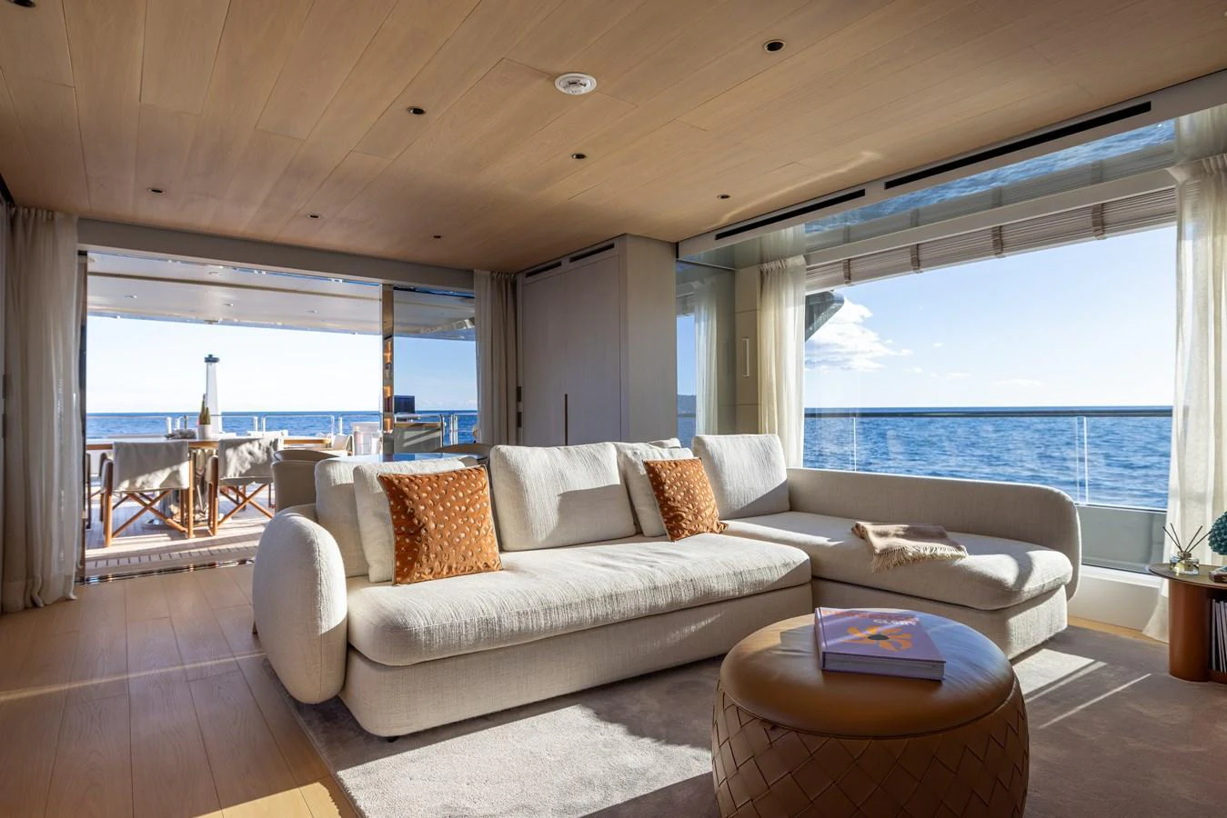 a living room with a large window aboard STELLAMAR Yacht for Sale