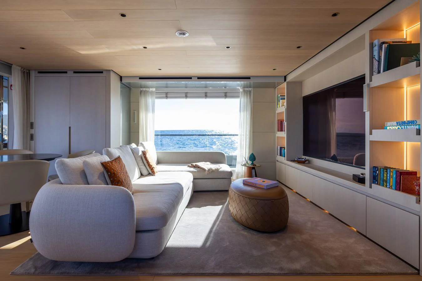 a living room with a large window aboard STELLAMAR Yacht for Sale