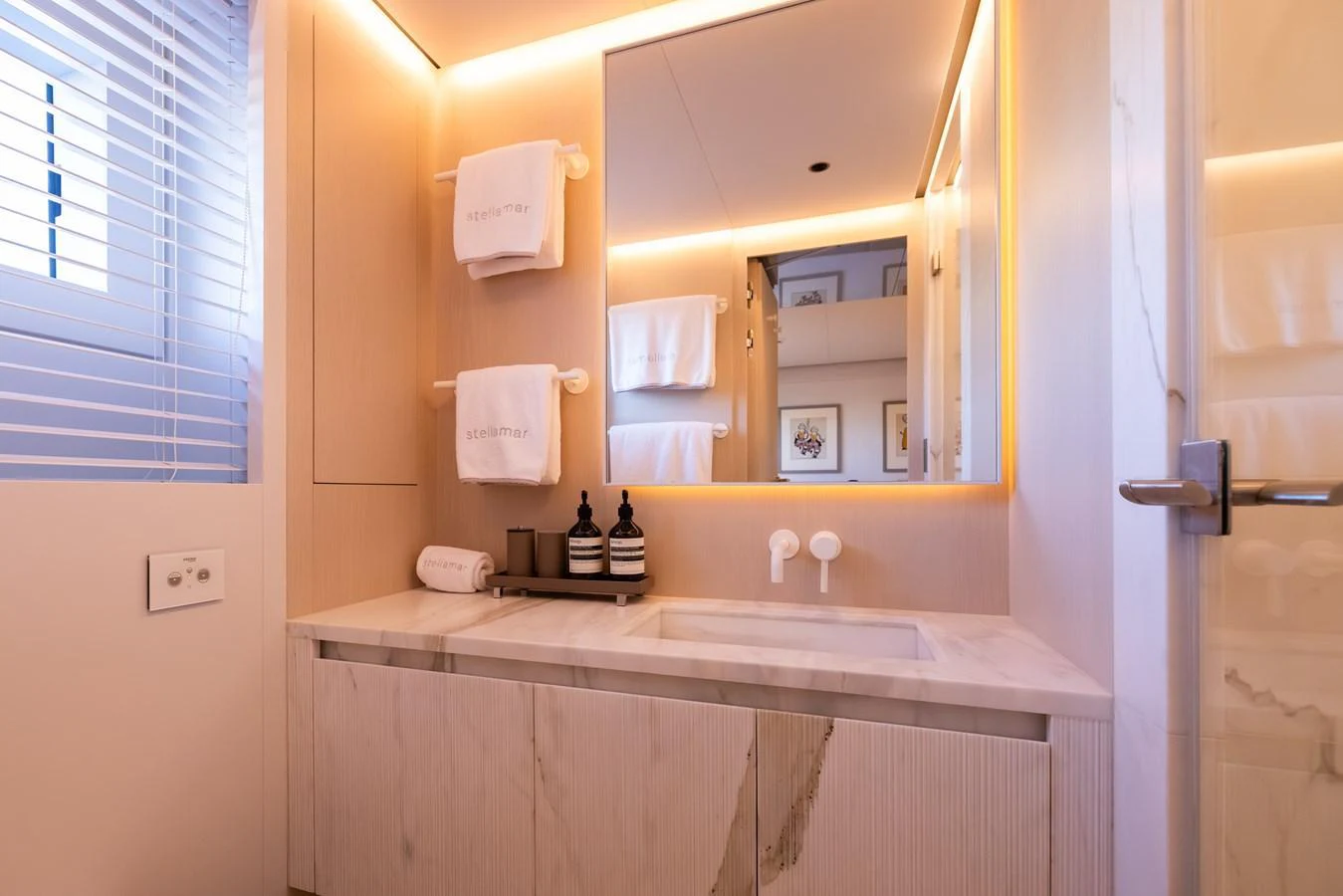 a bathroom with a mirror aboard STELLAMAR Yacht for Sale