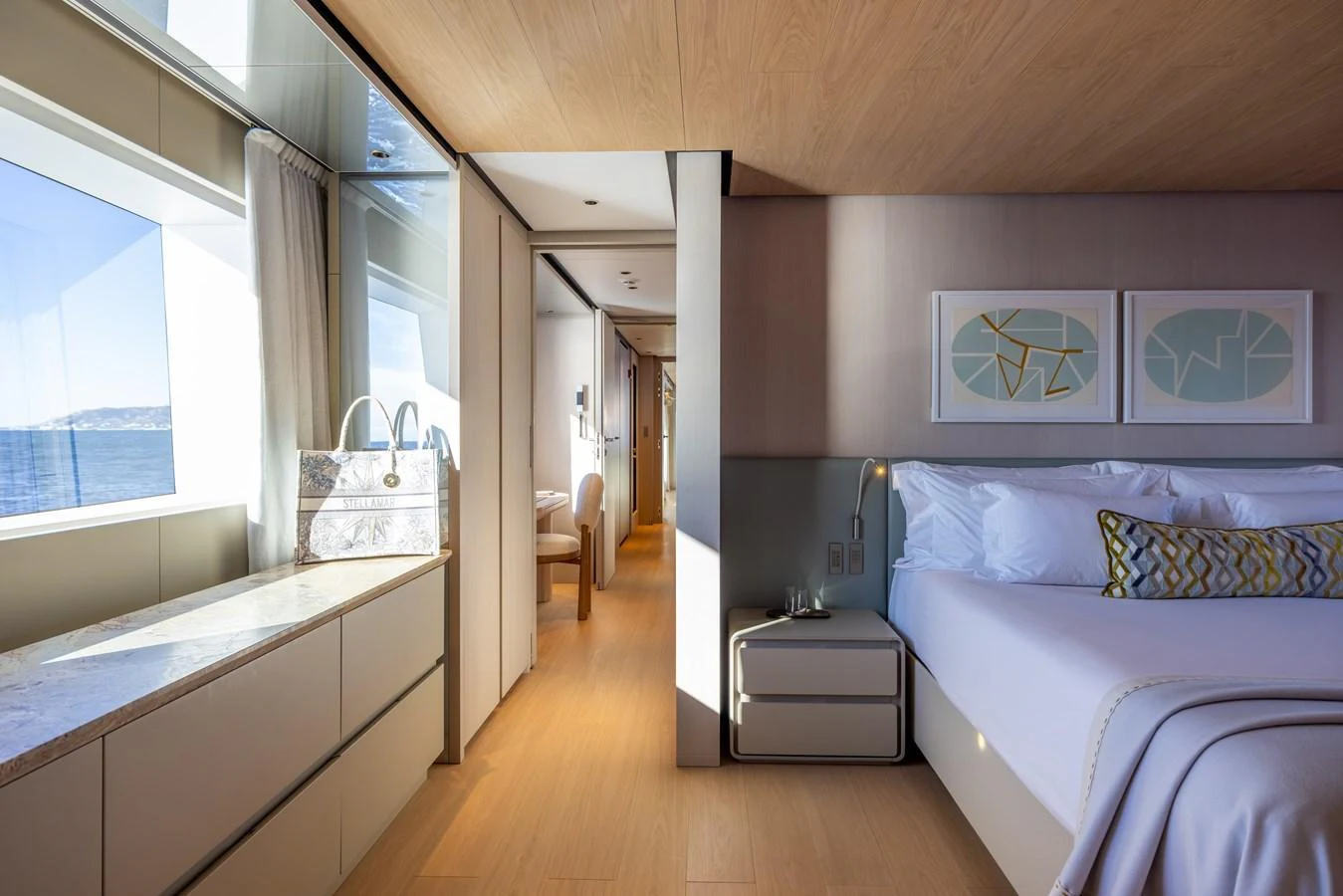 a bedroom with a bed and a sink aboard STELLAMAR Yacht for Sale