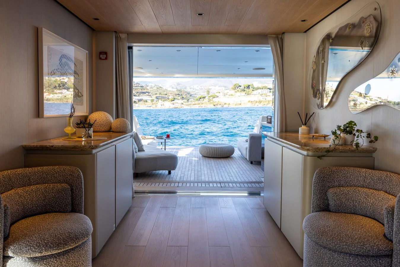 a living room with a large window aboard STELLAMAR Yacht for Sale