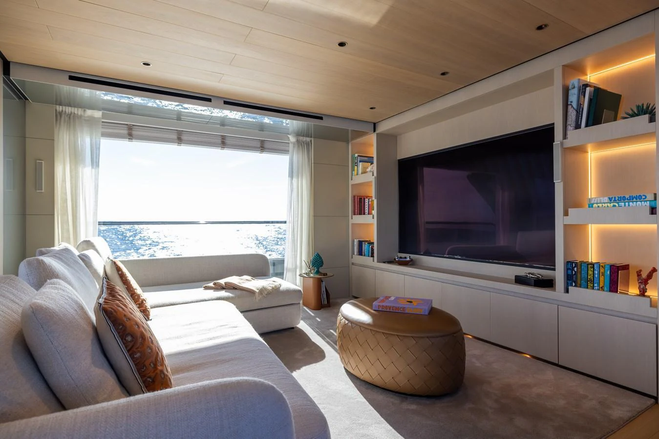 a living room with a large television aboard STELLAMAR Yacht for Sale