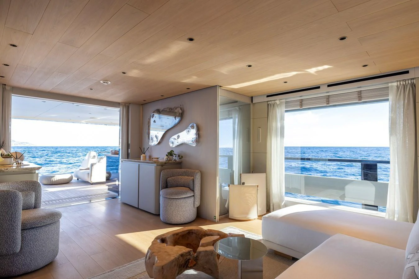 a living room with a large window aboard STELLAMAR Yacht for Sale