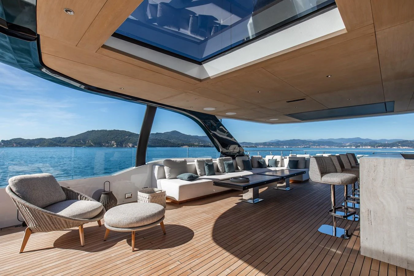The aft deck features a spacious and stylish seating area with panoramic views of the sea. aboard ANDALA Yacht for Sale