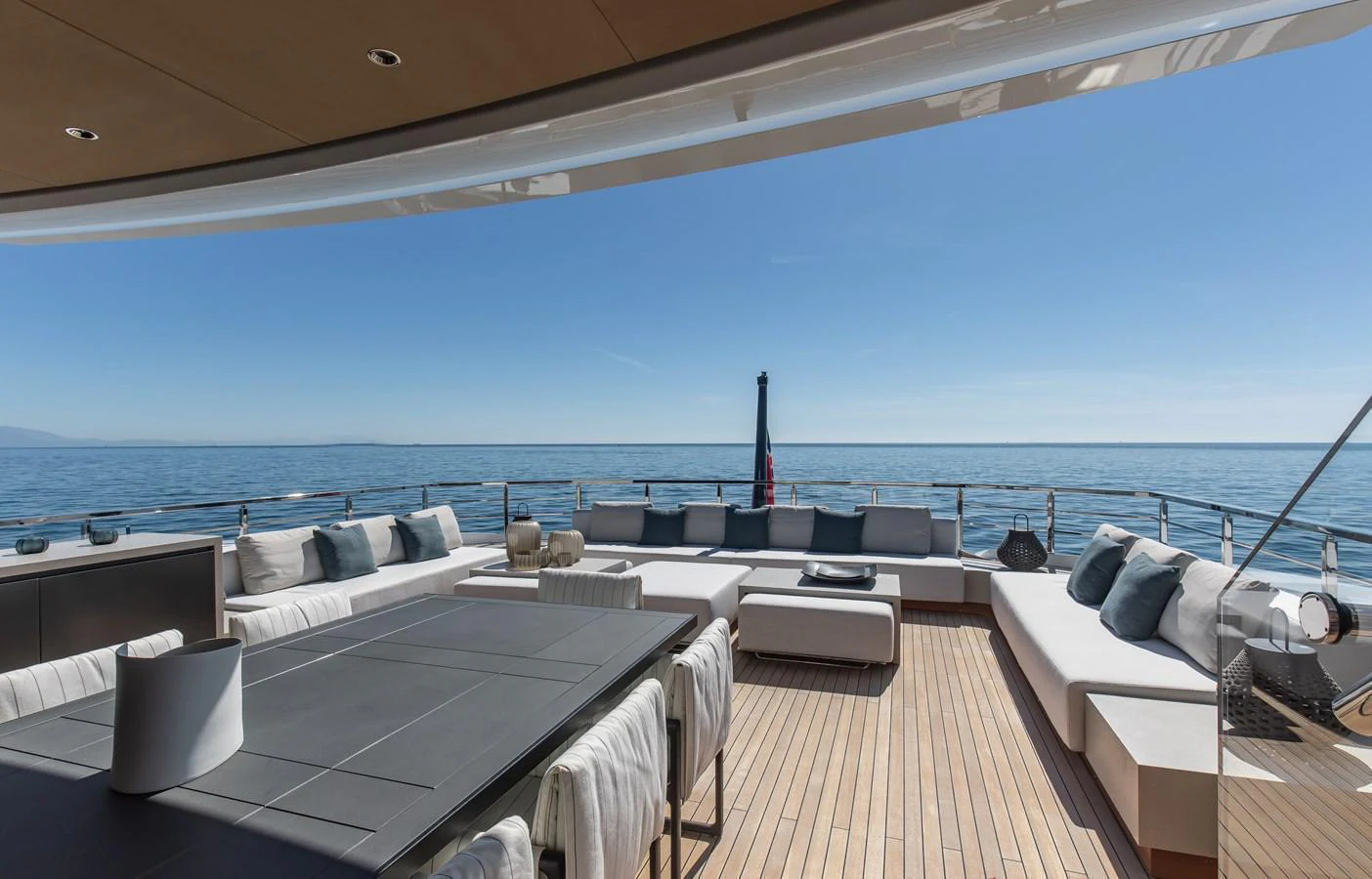 The aft deck offers a spacious and luxurious outdoor lounging area with stunning ocean views. aboard ANDALA Yacht for Sale