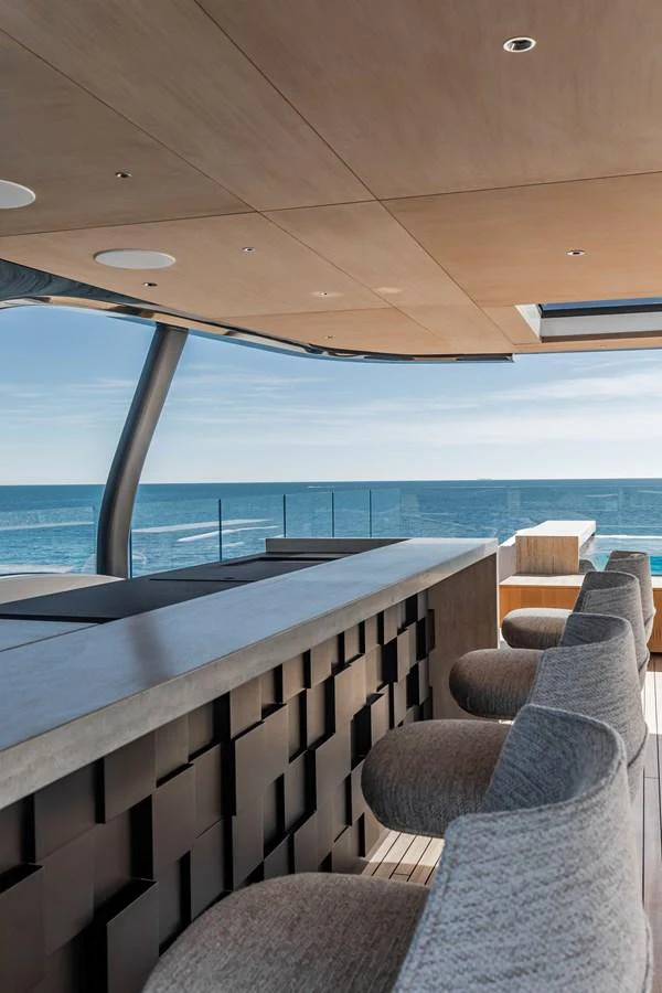 A stylish bar area on the yacht offers a perfect spot to enjoy ocean views. aboard ANDALA Yacht for Sale
