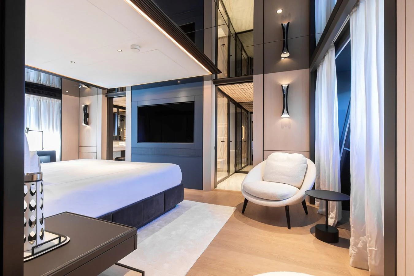 The master stateroom features a spacious layout with modern furnishings and elegant lighting. aboard ANDALA Yacht for Sale