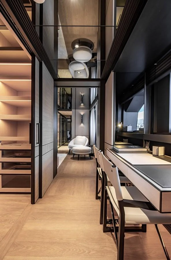 The yacht's interior features a sleek, modern design with a comfortable seating area and a well-appointed desk. aboard ANDALA Yacht for Sale
