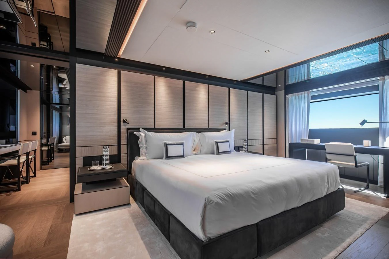The master stateroom features a spacious bed, modern furnishings, and ample natural light. aboard ANDALA Yacht for Sale
